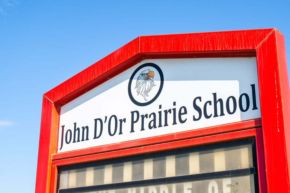 John D'Or Prairie School sign with eagle crest, Alberta