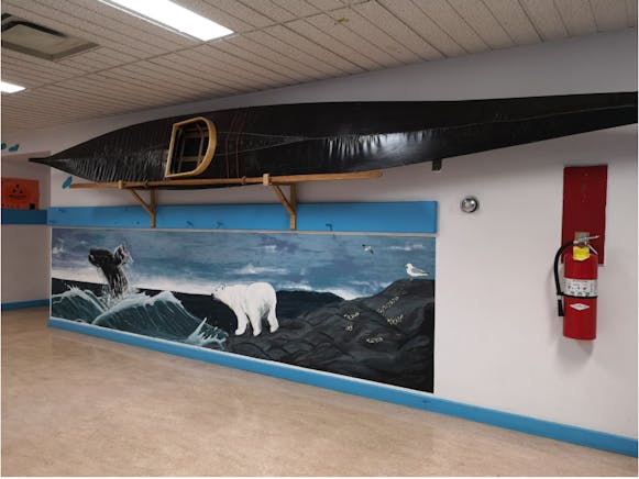 Qajaq and mural at Qaqqalik School.